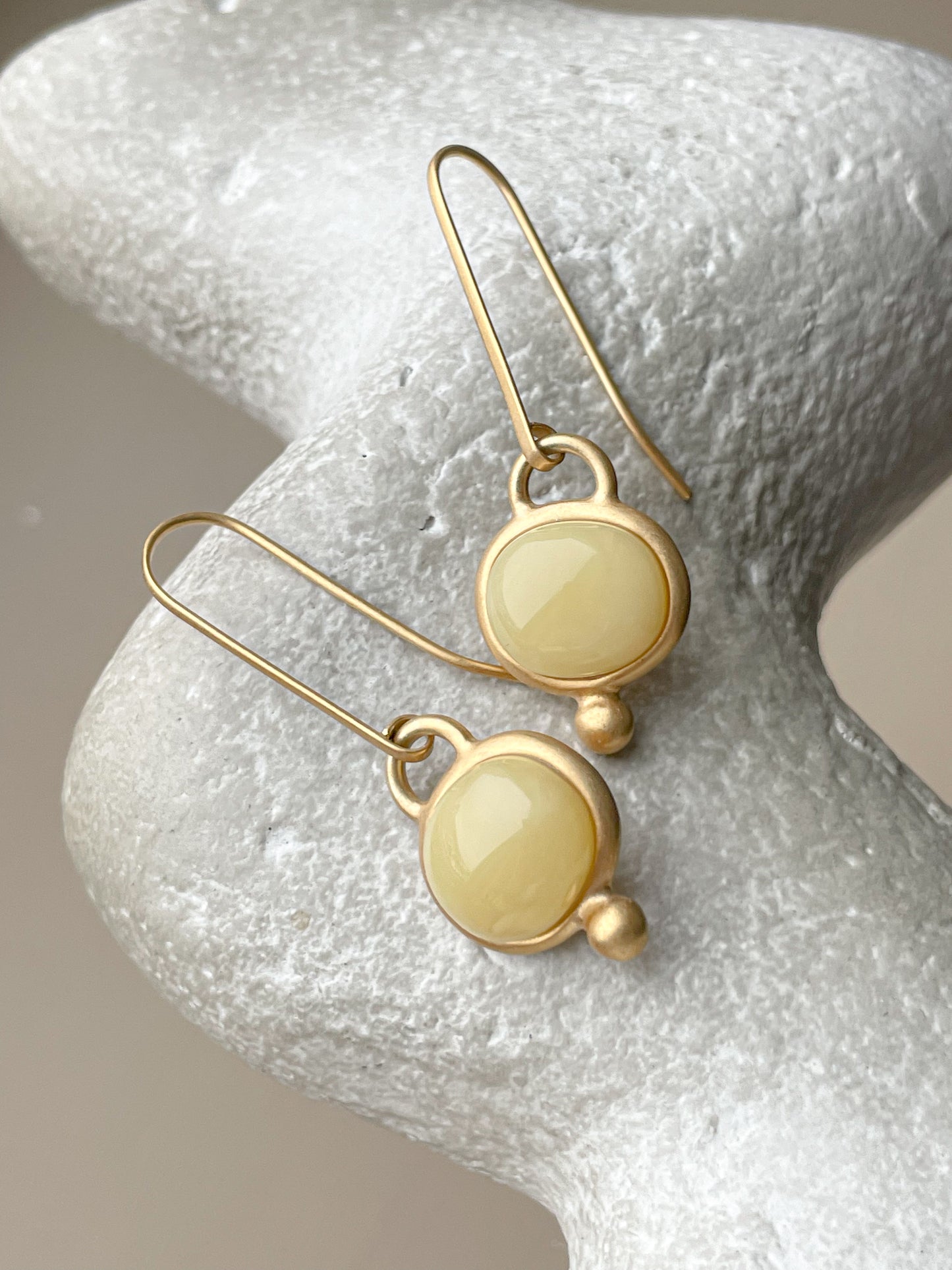 Gold plated wire hook earrings with honey amber