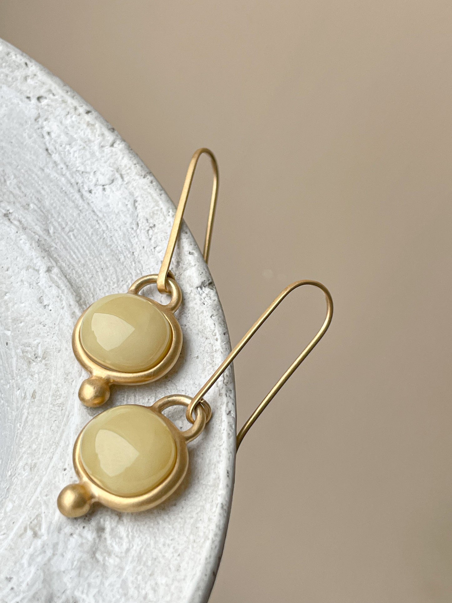 Gold plated wire hook earrings with honey amber