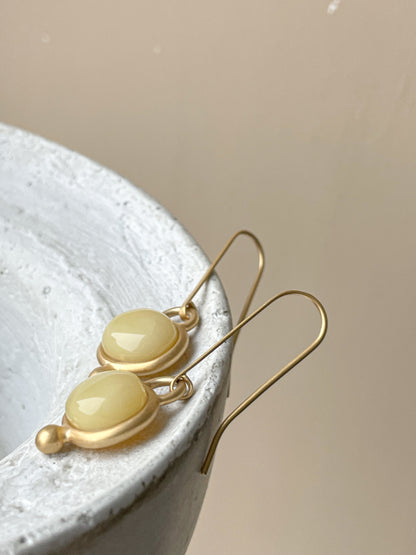 Gold plated wire hook earrings with honey amber