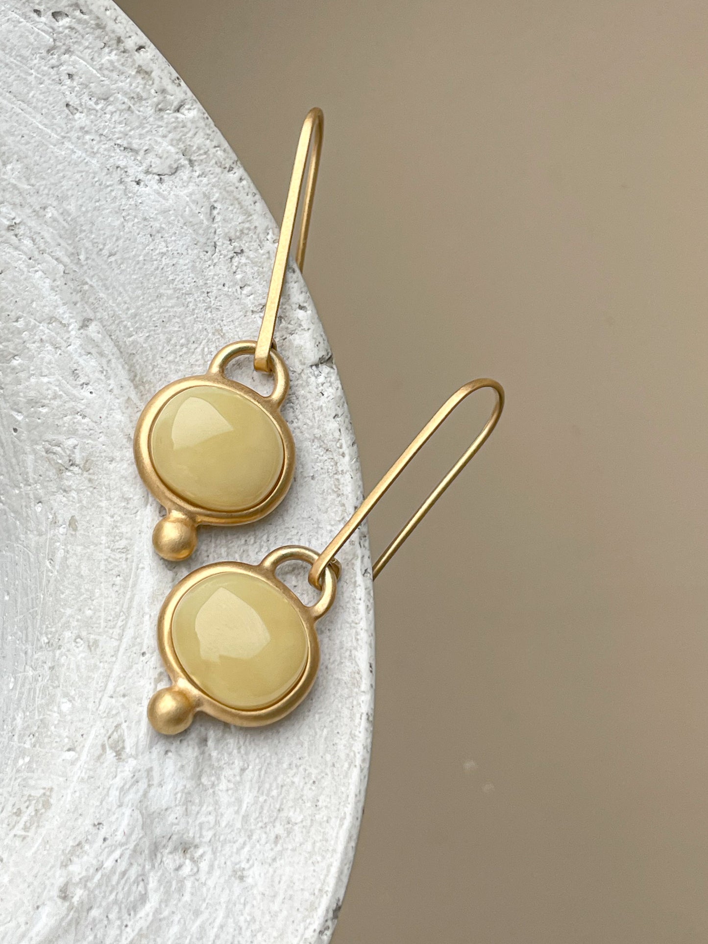 Gold plated wire hook earrings with honey amber