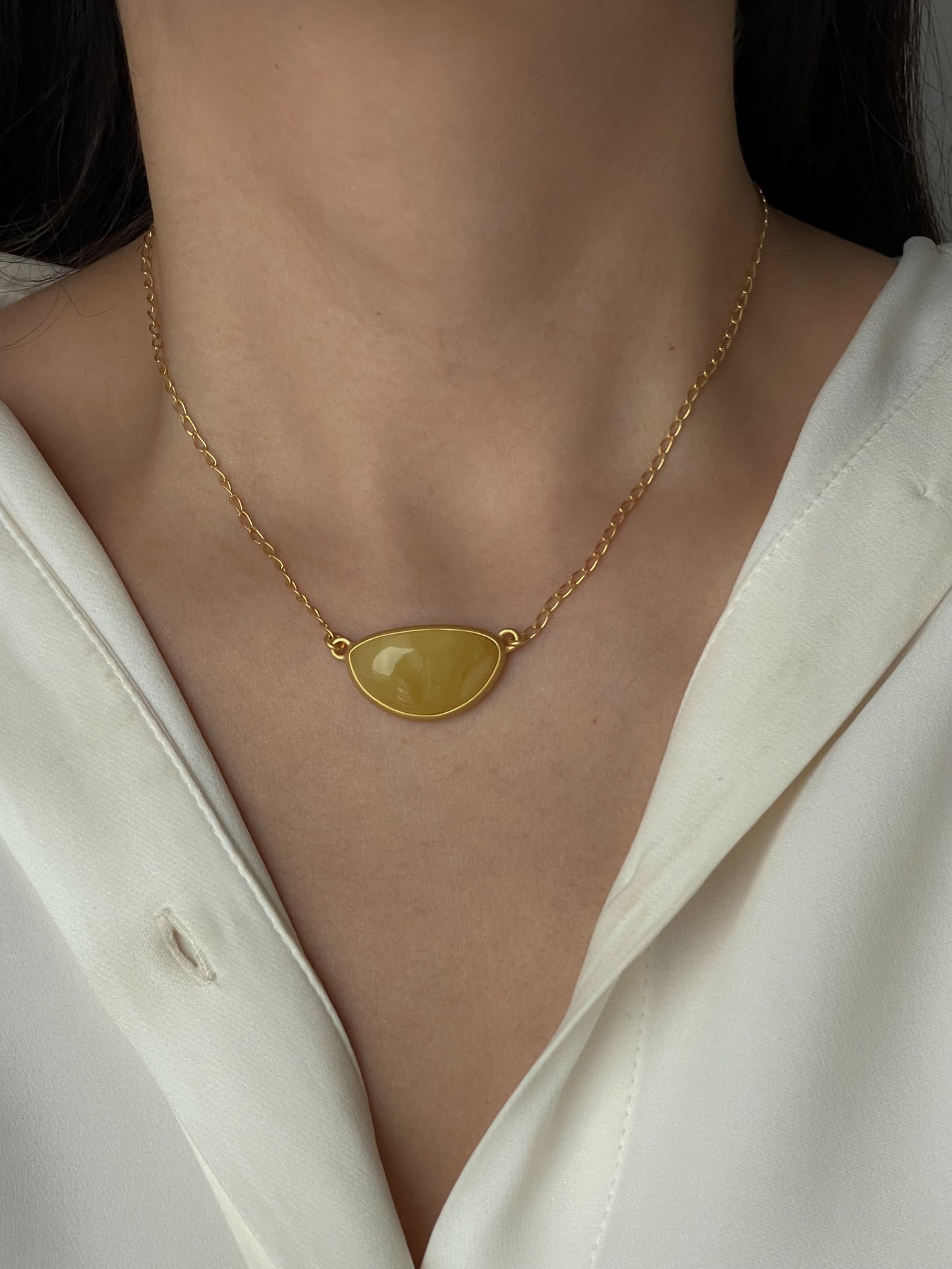 Gold plated pendant with matte amber