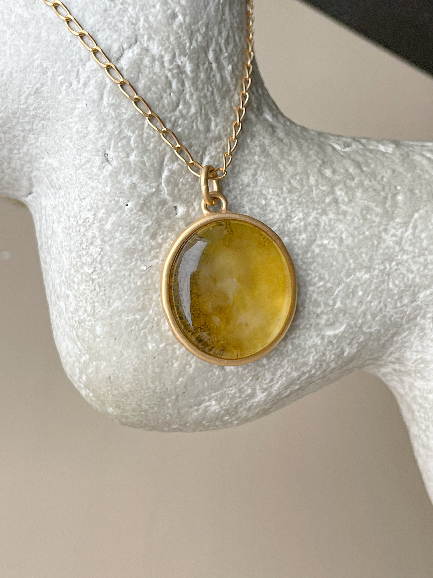 Gold plated pendant with yellow amber