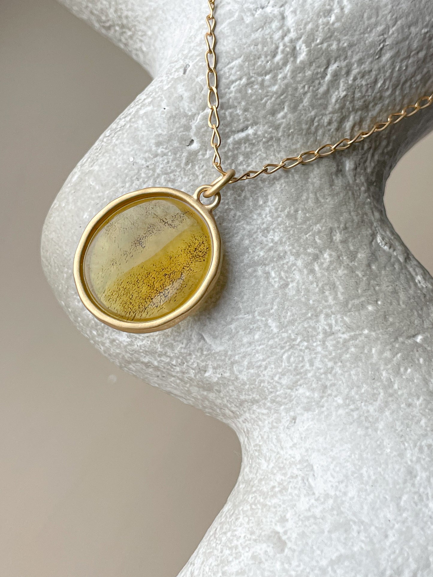 Gold plated pendant with yellow amber