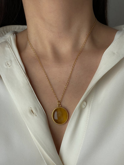 Gold plated pendant with yellow amber