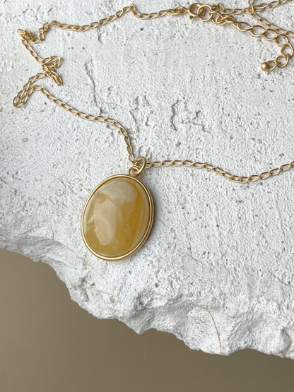 Gold plated pendant with matte amber