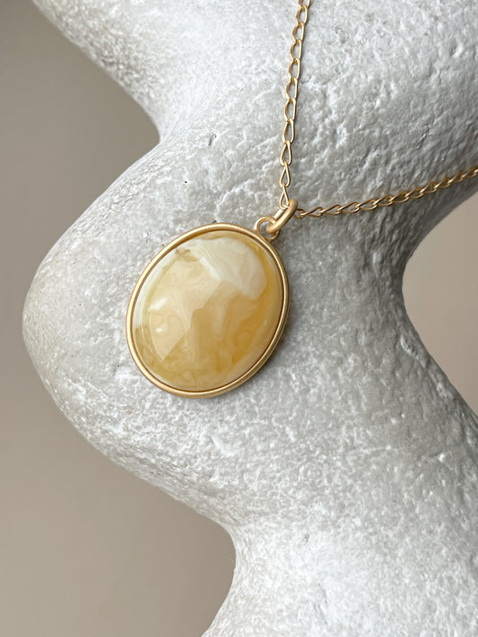 Gold plated pendant with matte amber