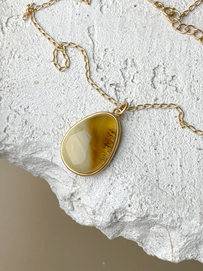 Gold plated pendant with mixed amber