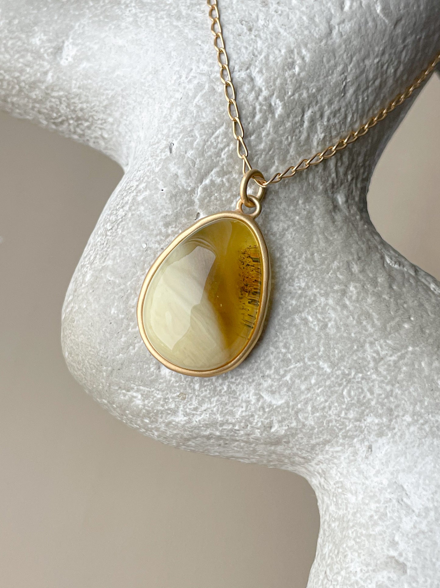 Gold plated pendant with mixed amber