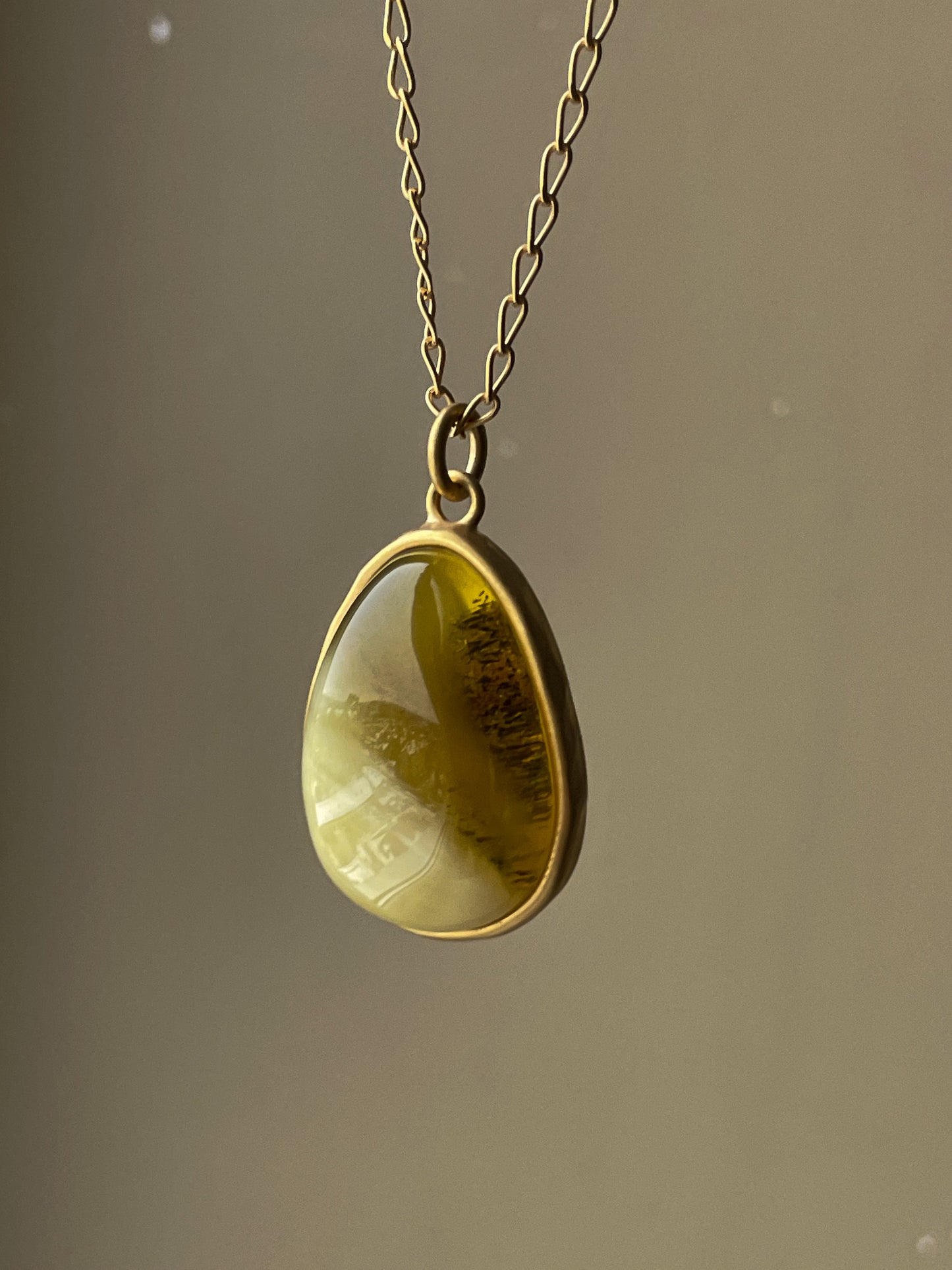 Gold plated pendant with mixed amber