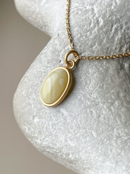 Gold plated pendant with matte amber