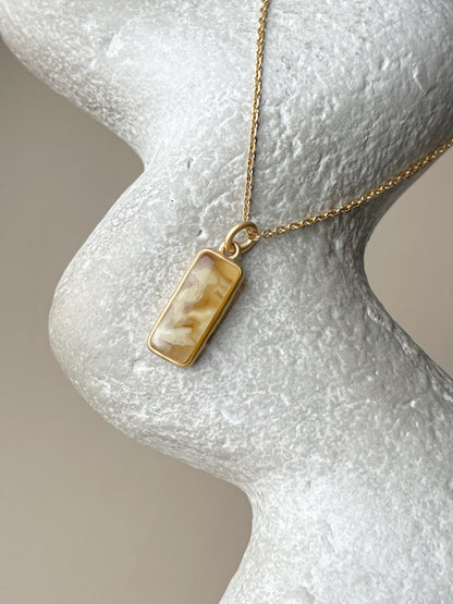 Gold plated pendant with matte amber