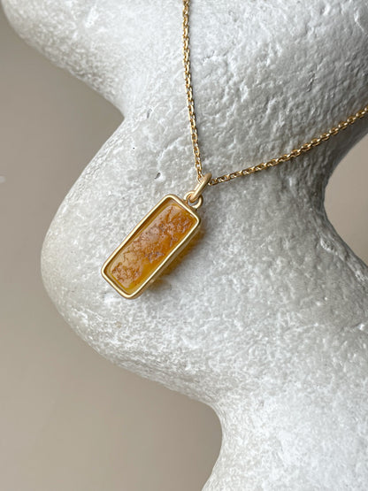 Gold plated pendant with matte amber