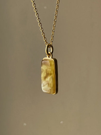 Gold plated pendant with matte amber