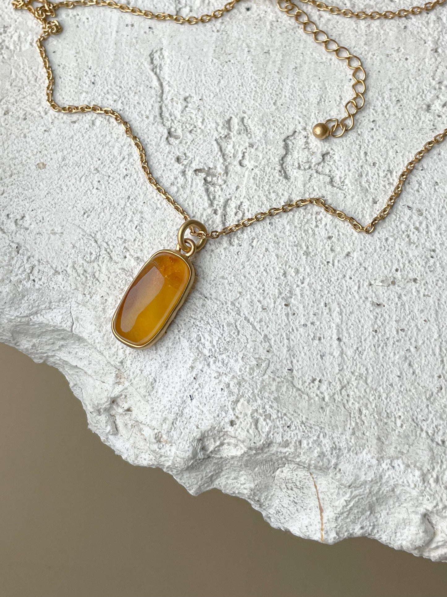 Gold plated pendant with honey amber