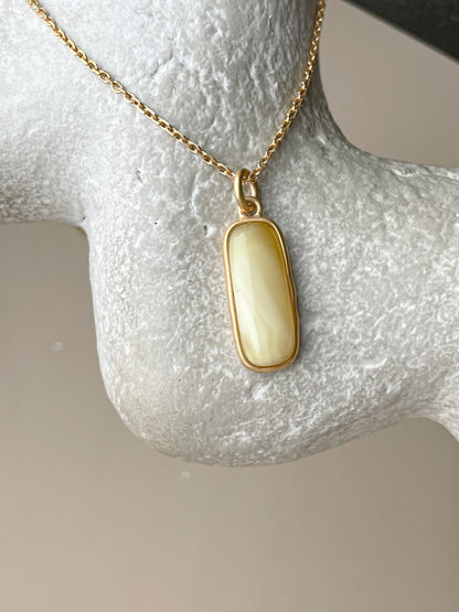 Gold plated pendant with matte amber