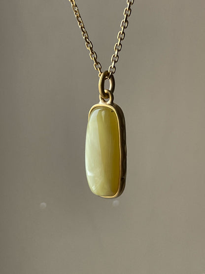 Gold plated pendant with matte amber