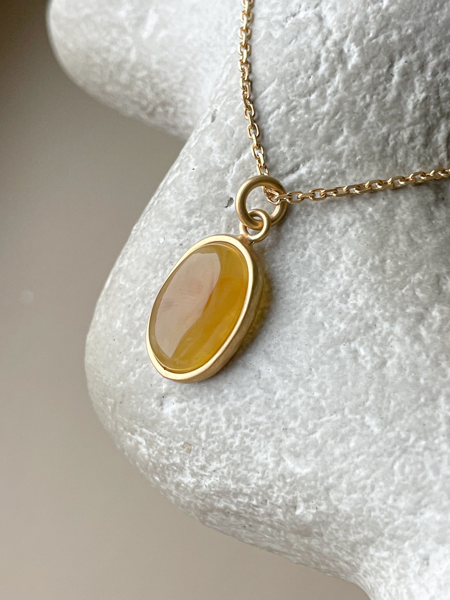 Gold plated pendant with honey amber