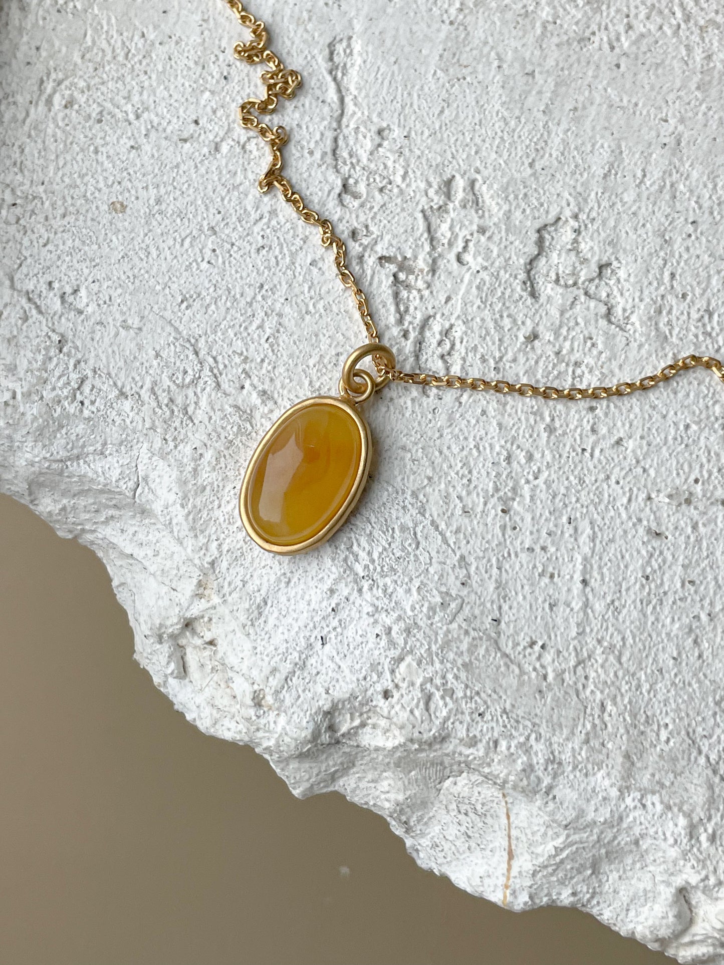 Gold plated pendant with honey amber