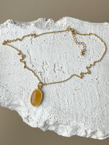 Gold plated pendant with honey amber