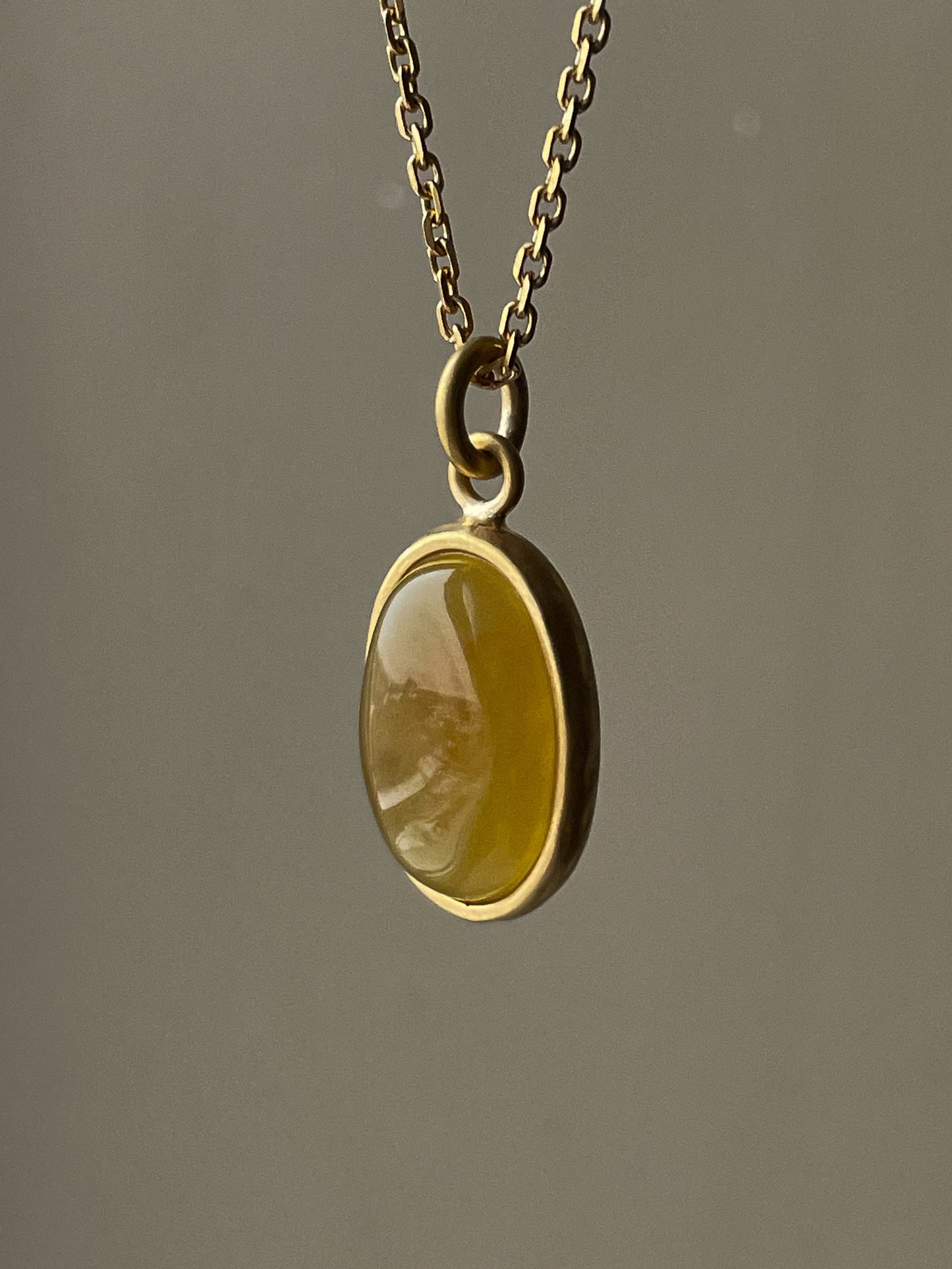 Gold plated pendant with honey amber