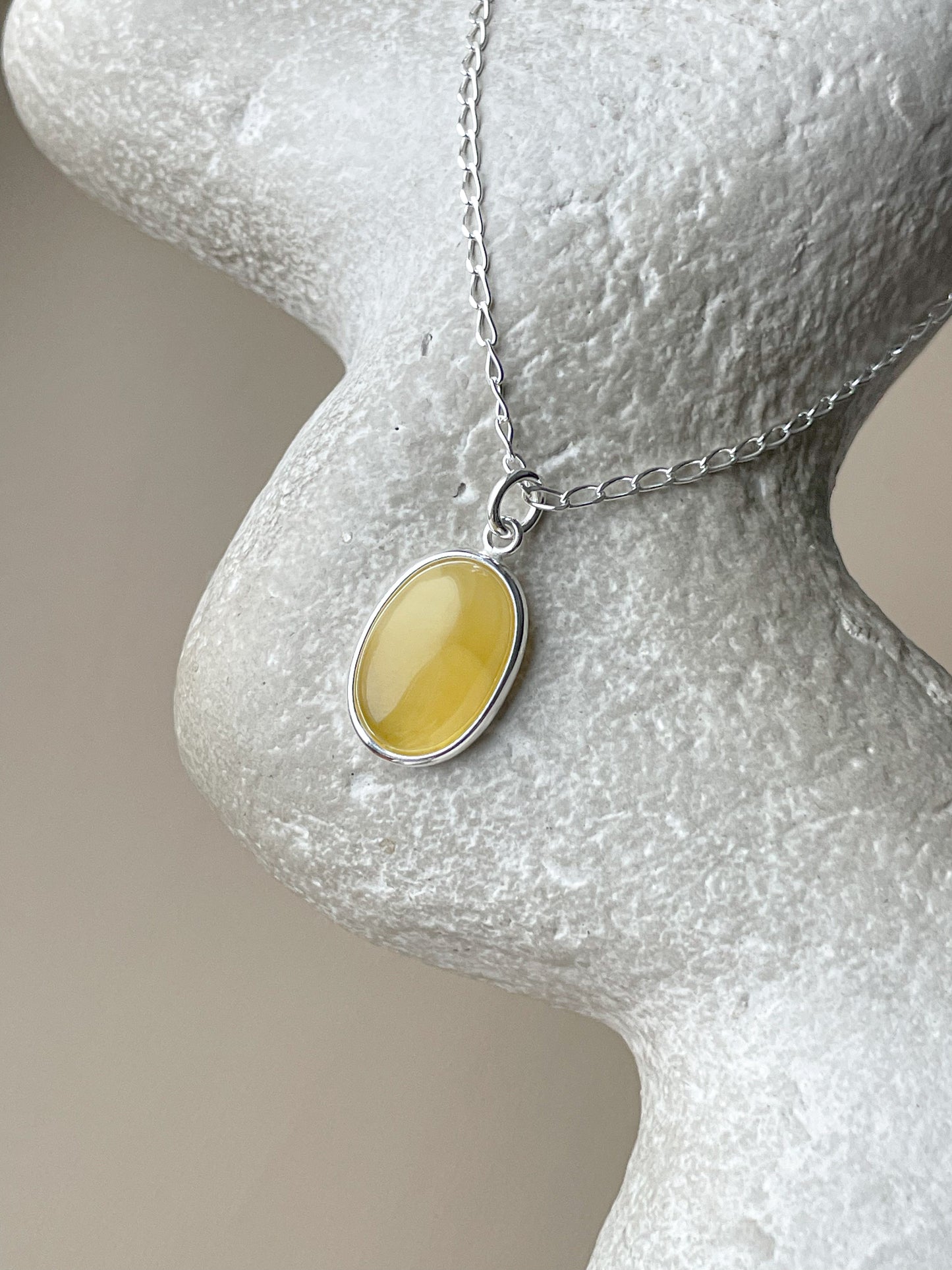 Sterling silver pendant with yellow amber