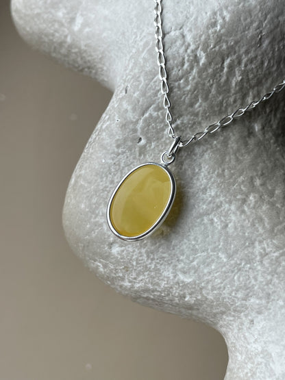 Sterling silver pendant with yellow amber