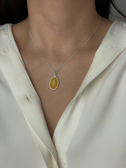 Sterling silver pendant with yellow amber