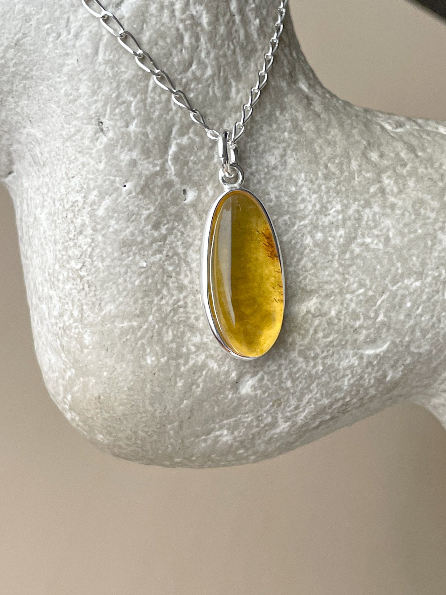 Sterling silver pendant with yellow amber