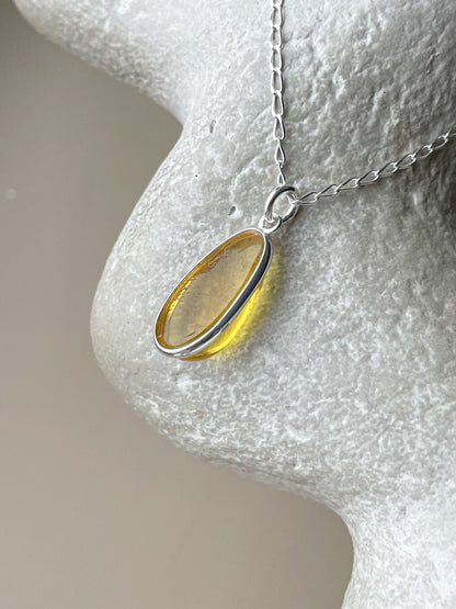Sterling silver pendant with yellow amber