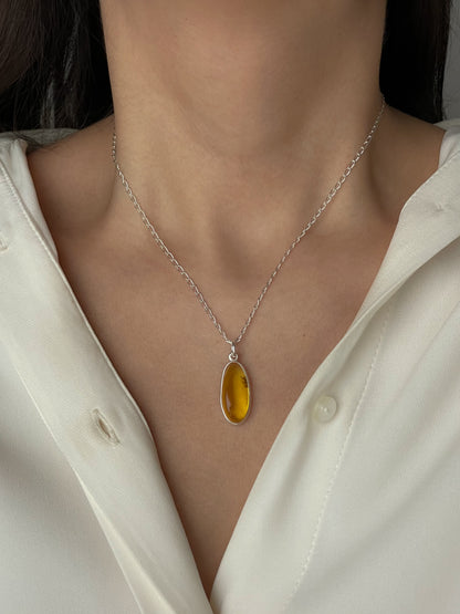 Sterling silver pendant with yellow amber