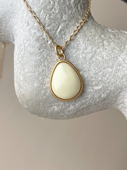 Gold plated pendant with white amber