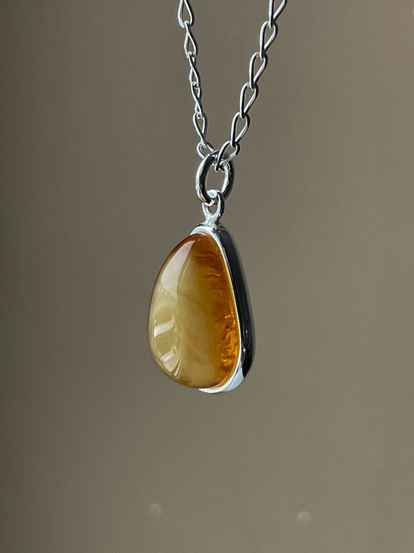 Sterling silver pendant with honey amber