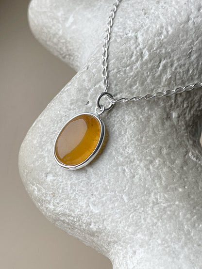 Sterling silver pendant with honey amber