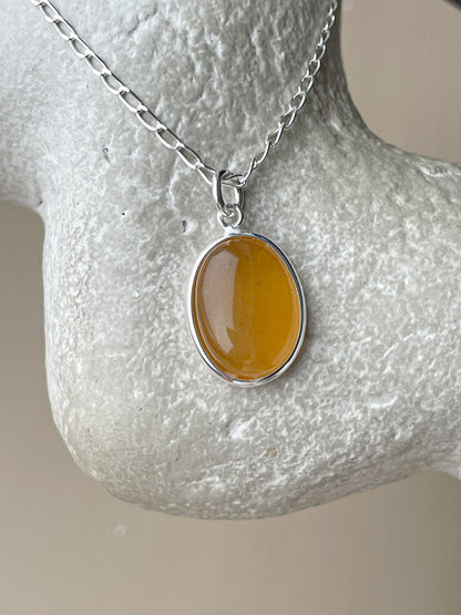 Sterling silver pendant with honey amber