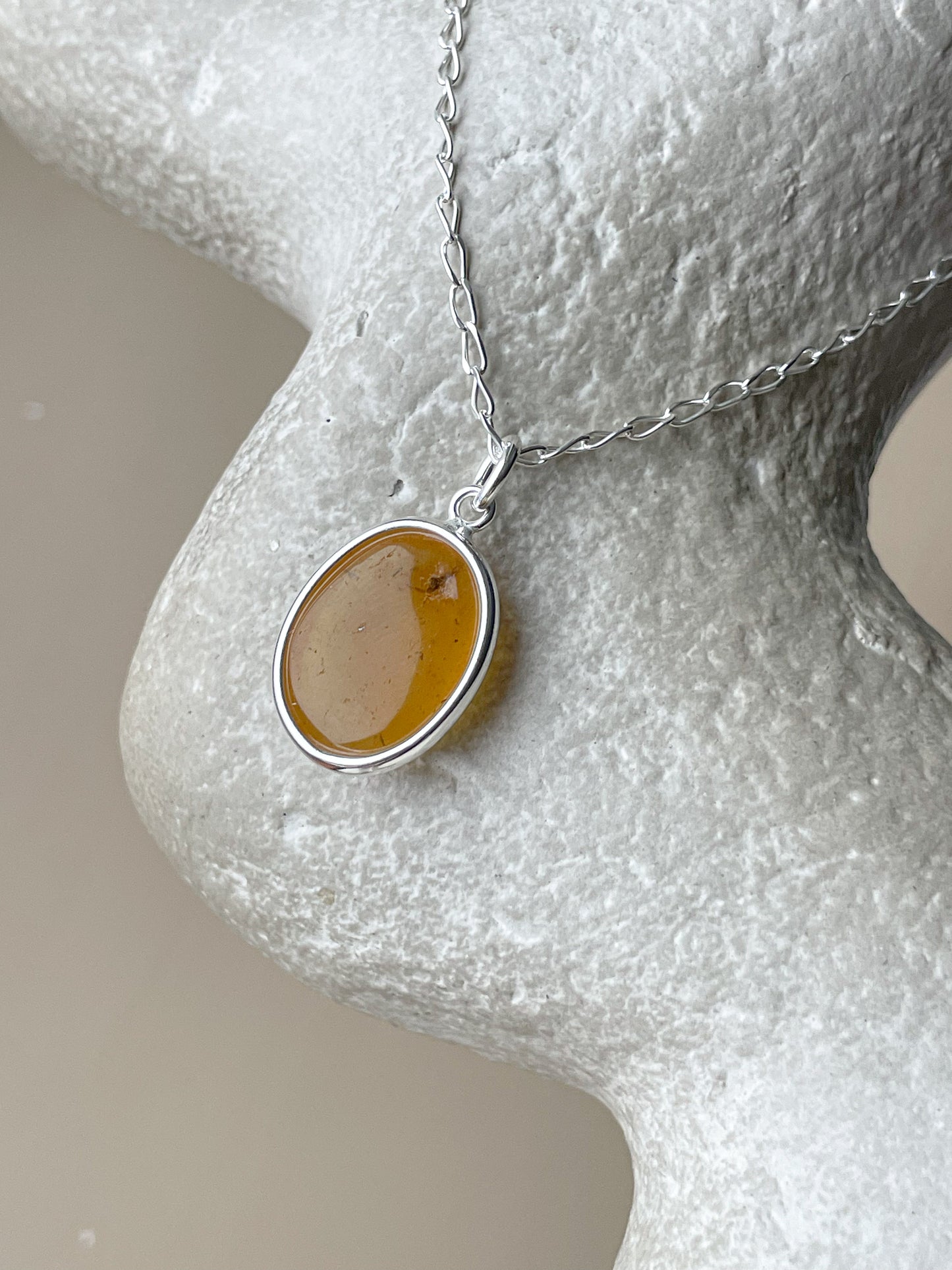 Sterling silver pendant with honey amber