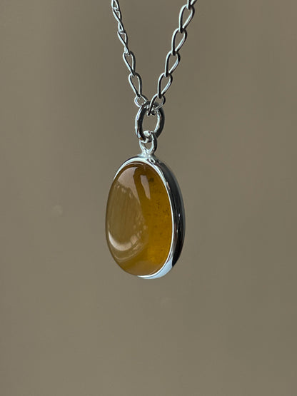 Sterling silver pendant with honey amber