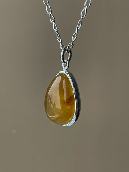 Sterling silver pendant with yellow amber