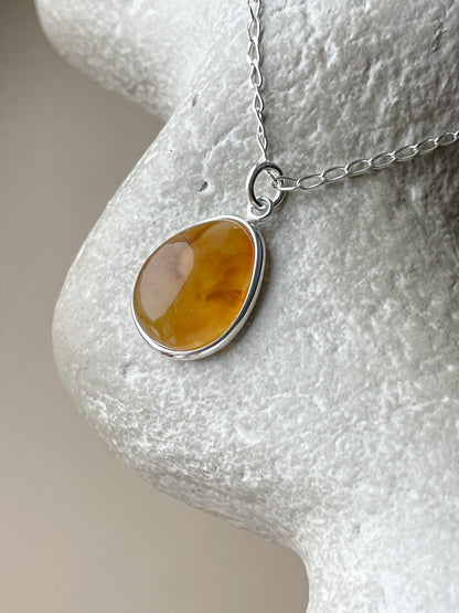 Sterling silver pendant with yellow amber