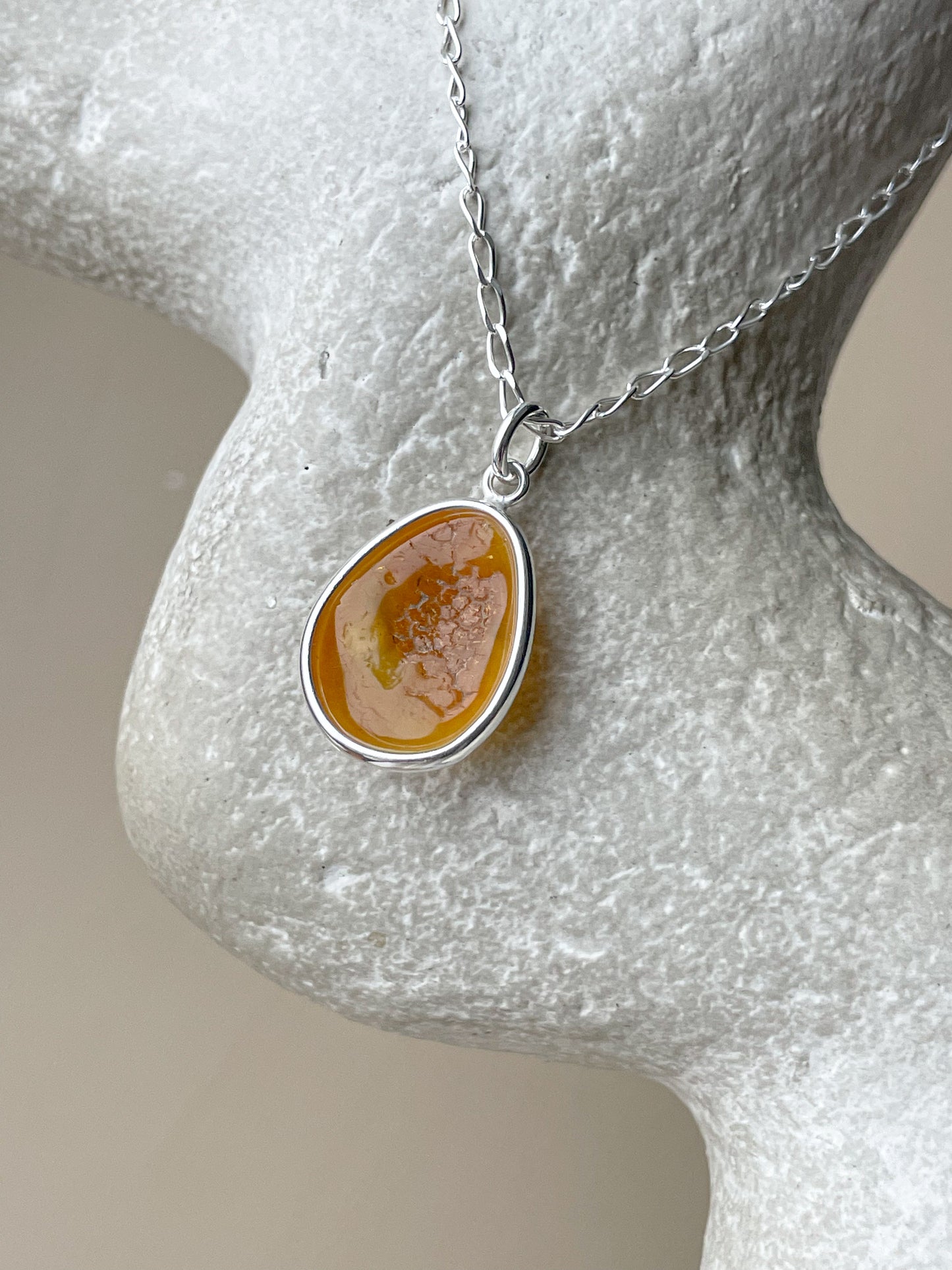 Sterling silver pendant with yellow amber