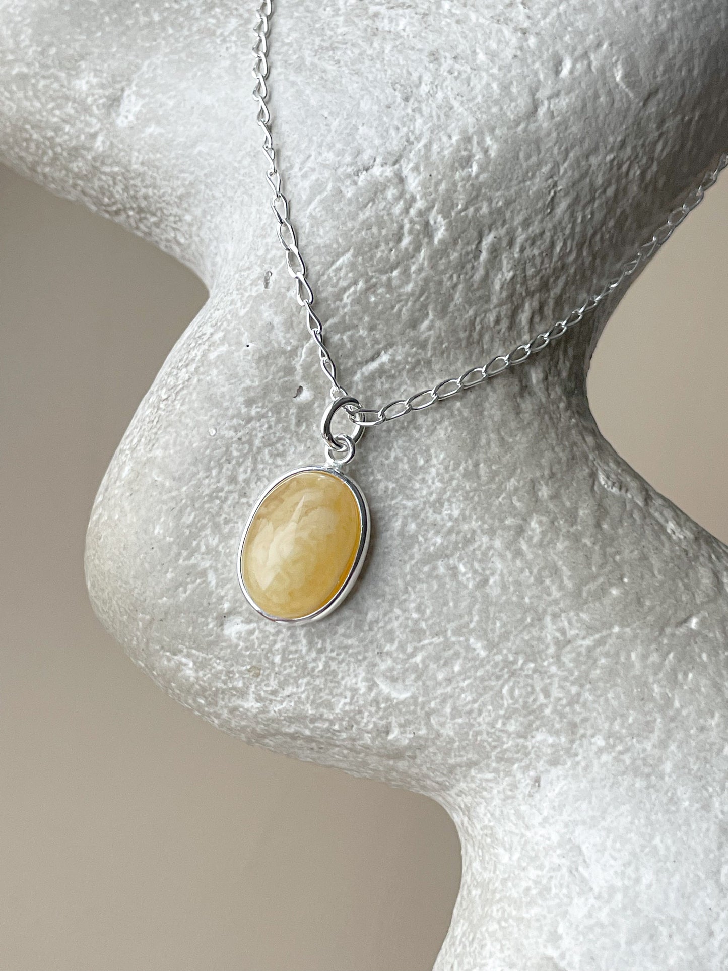 Sterling silver pendant with matte amber