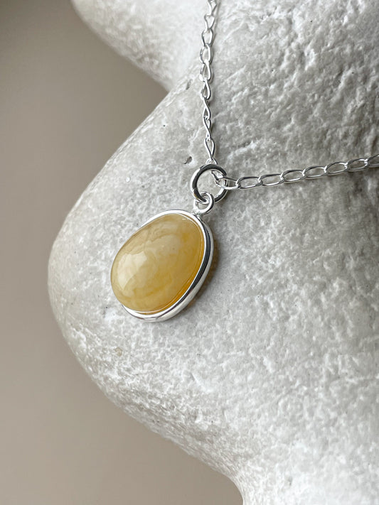 Sterling silver pendant with matte amber