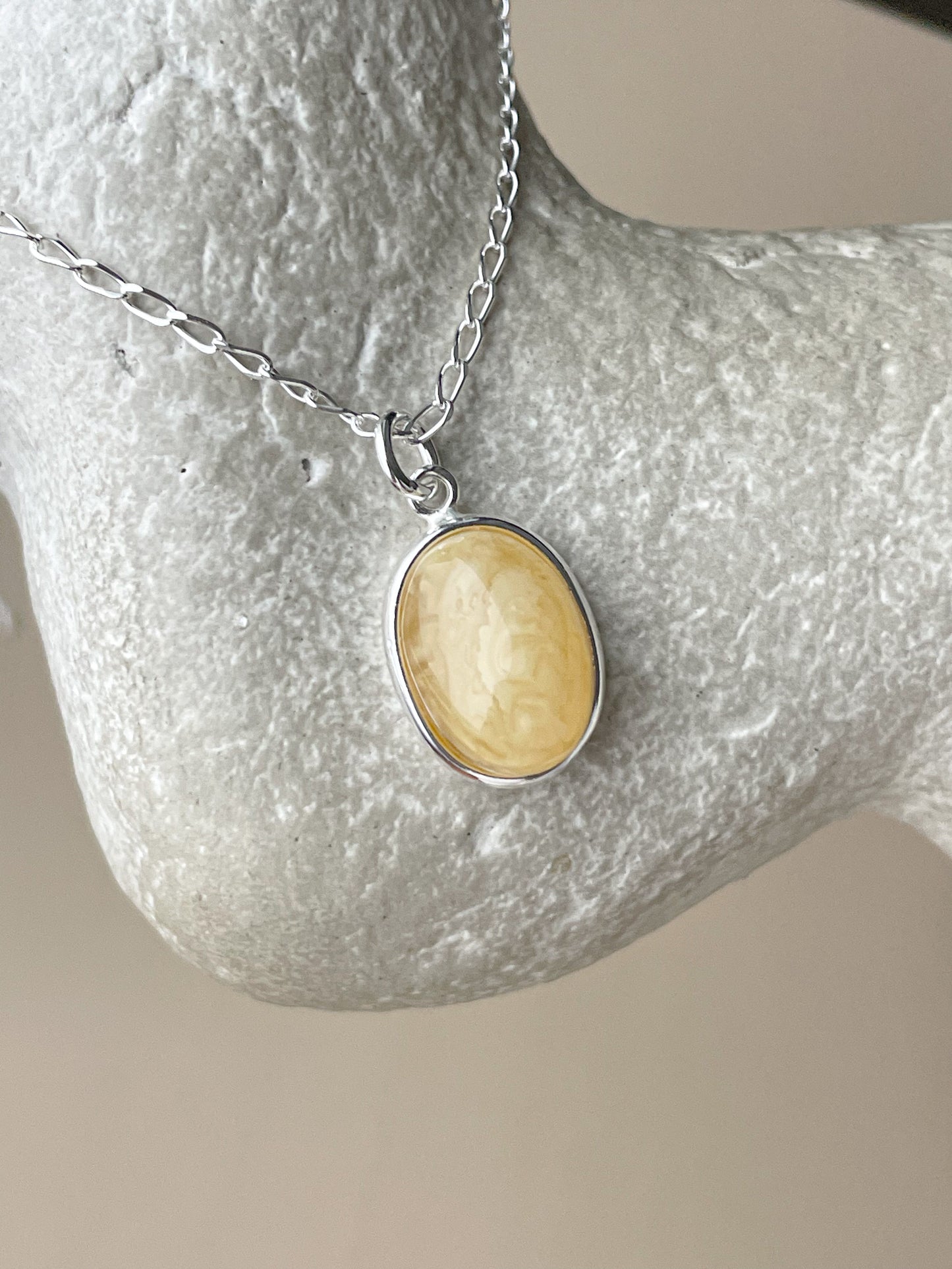 Sterling silver pendant with matte amber