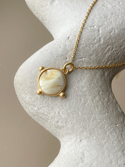 Gold plated pendant with white amber