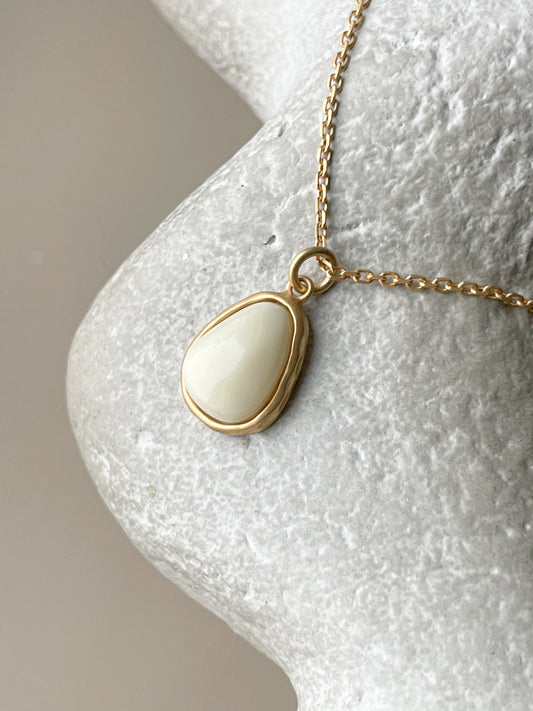 Gold plated pendant with white amber