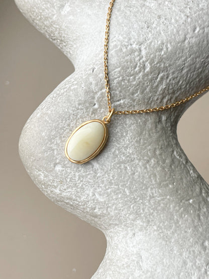 Gold plated pendant with white amber