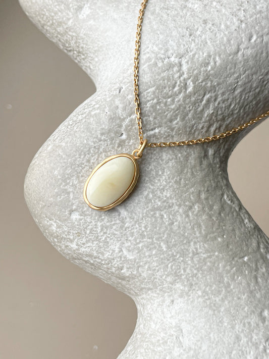 Gold plated pendant with white amber