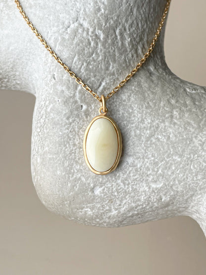 Gold plated pendant with white amber