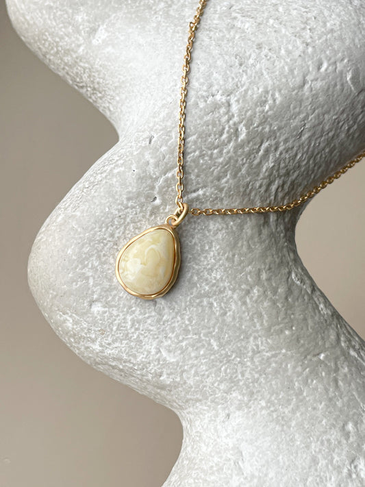 Gold plated pendant with white amber