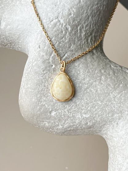 Gold plated pendant with white amber