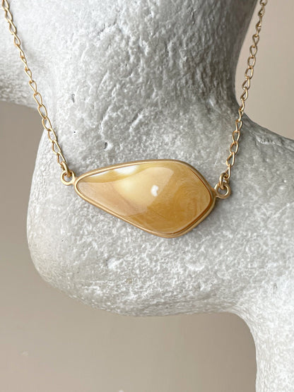 Gold plated pendant with matte amber